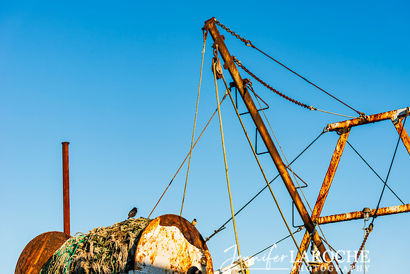 Rusty Fishing Vessel Under Blue Sky