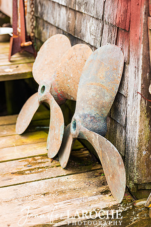 Patina‑Rich Boat Propellers at the Old Fishing Shack