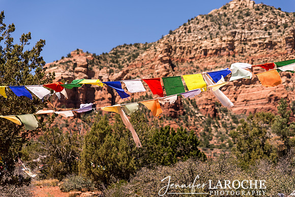 sedona arizona tibetan prayer flags with thunder mountain in the background