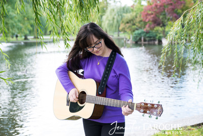 playing guitar at the Boston Public Garden pond
